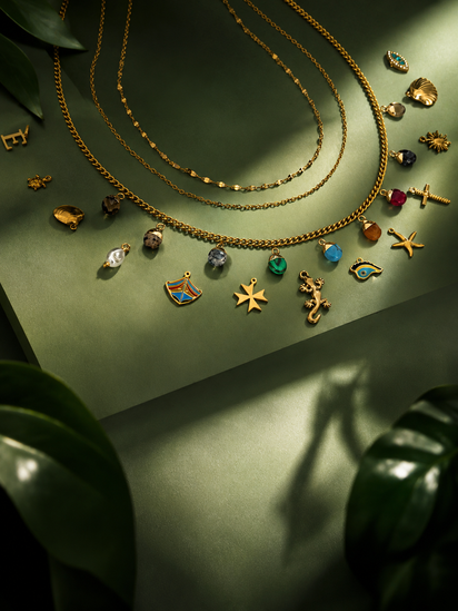 Customizable charms necklace with gold-toned Maltese-inspired pendants